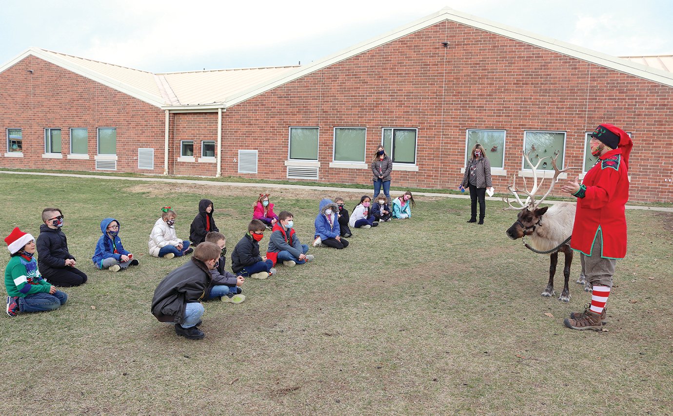 Jill Callis' second-grade class at Sommer Elementary enjoys some time outside while learning about reindeer on a mild December Friday afternoon.